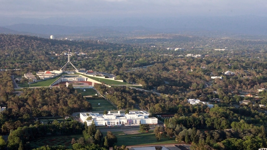 View from a hot air balloon above the Museum of Australian Democracy and Parliament House.