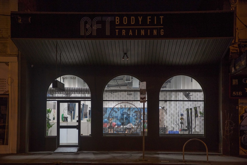 Body Fit gym shop front lit up at night