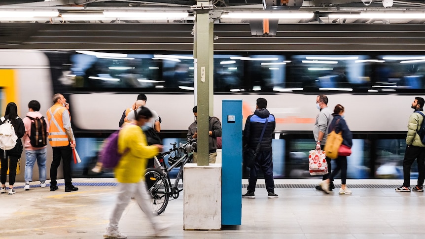 people at a rail station