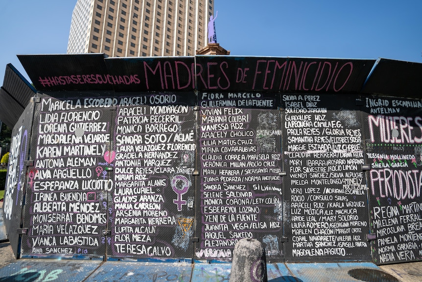 Countless names of female activists written on walls at a monument for women 