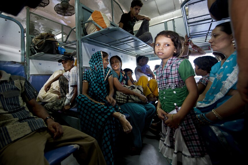 Indian girl waits on train stuck by blackout