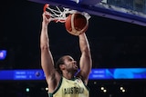Xavier Cooks dunking the basketball through a hoop.
