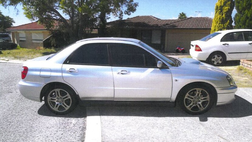 A silver Subaru parked on a driveway outside a Mirrabooka home during the daytime.