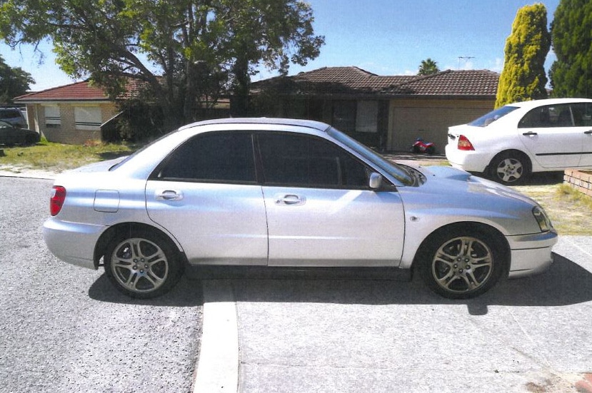A silver Subaru parked on a driveway outside a Mirrabooka home during the daytime.