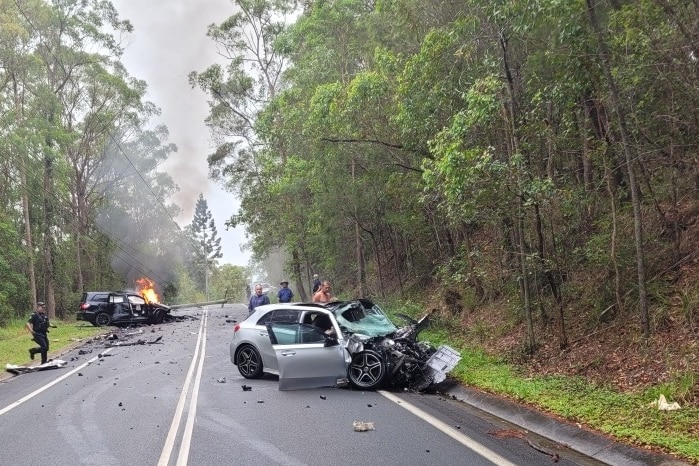 Bonogin crash scene with car on side of road.