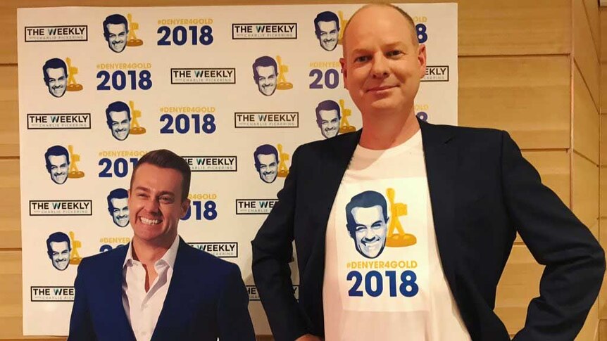 Tom Gleesonstands next to a cardboard cut-out of Grant Denyer.