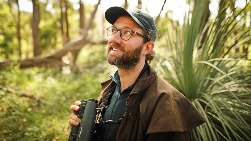 Ecologist Tom Hunt looks for birds in a story about how to attract native birds to your backyard.