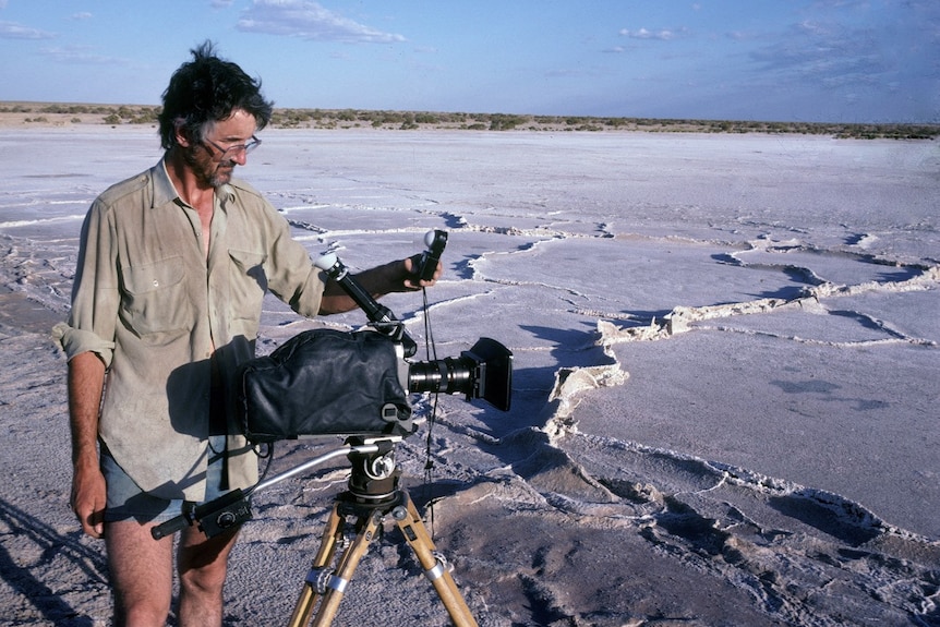 David Parer filming on the dried salt crust of Lake Eyre