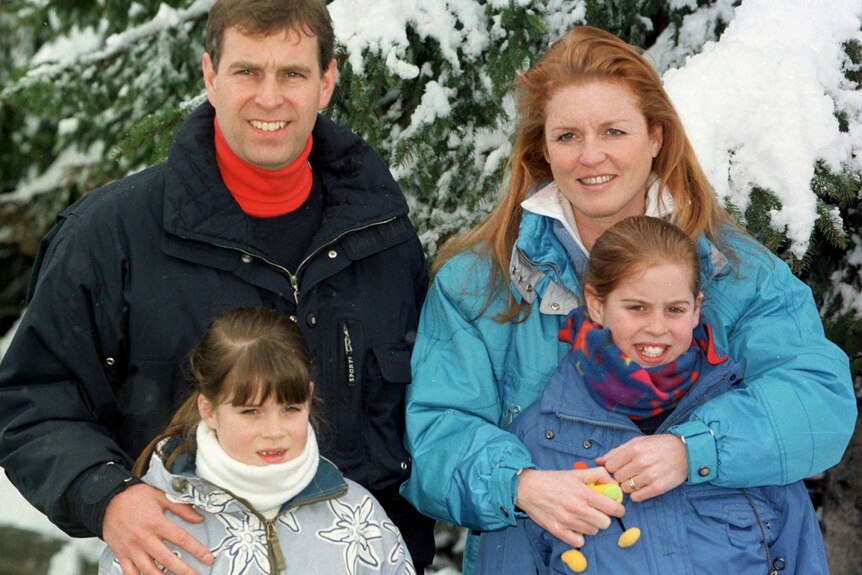 Prince Andrew (rear L), the Duchess of York (rear R) and their daughters Eugenie (front L) and Beatrice in skiing gear