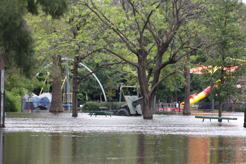 children's playground submerged by floodwater
