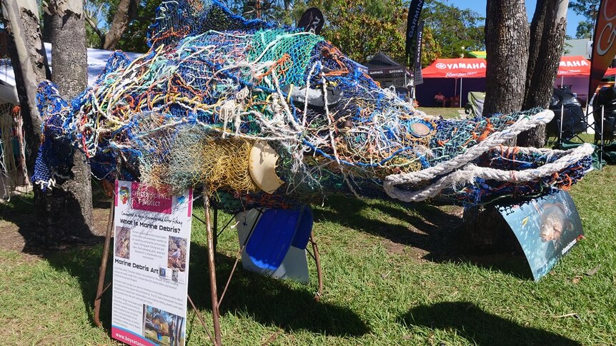 big fish sculpture made from rope, net, plastic and another marine debris