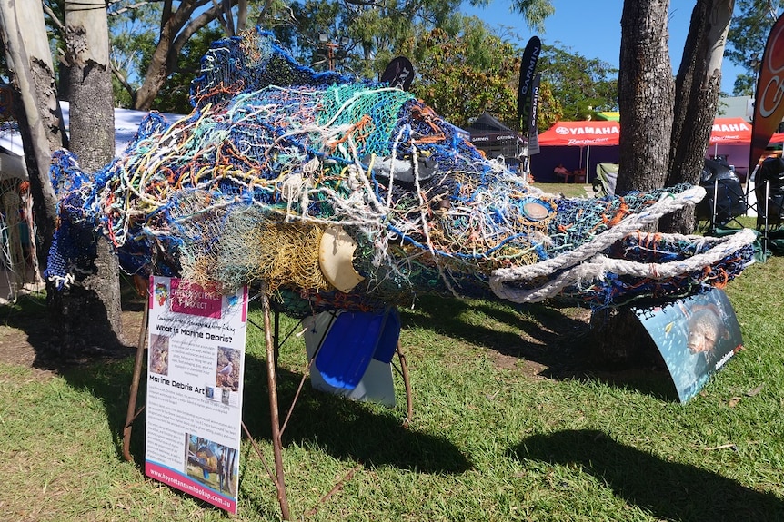 big fish sculpture made from rope, net, plastic and another marine debris