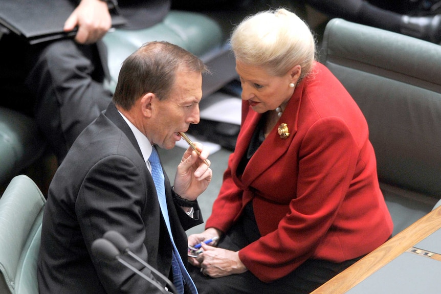 Tony Abbott listens to Bronwyn Bishop in Parliament