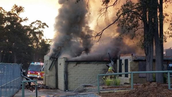 Fire fighters are battling to save classrooms at St Columba's Catholic College at Springwood in the Blue Mountains