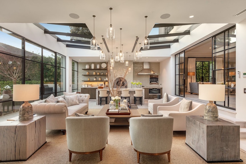 A living area with kitchen and pizza oven.