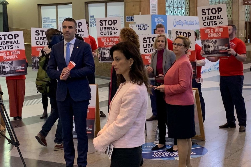 People standing with protest signs