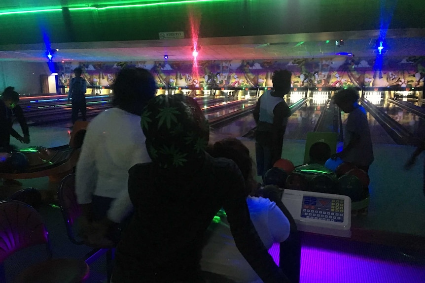 People inside a disco bowling alley in Alice Springs