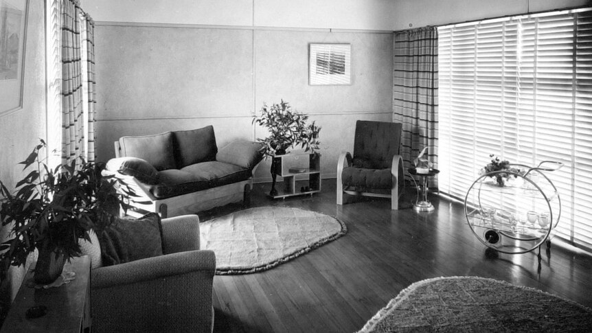 A black and white photo from 1949 of the lounge room of a Brisbane home.
