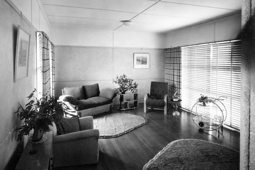 A black and white photo from 1949 of the lounge room of a Brisbane home.