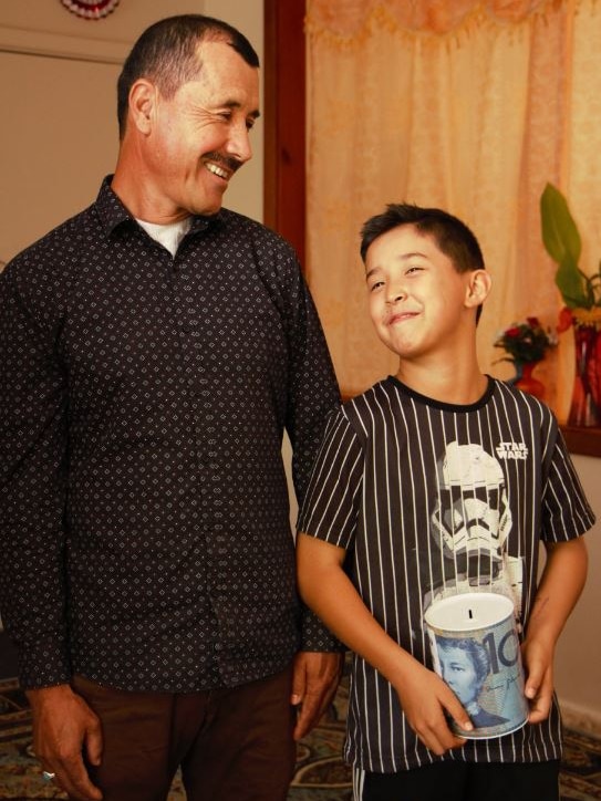 Murtaza and his father stand next to each other