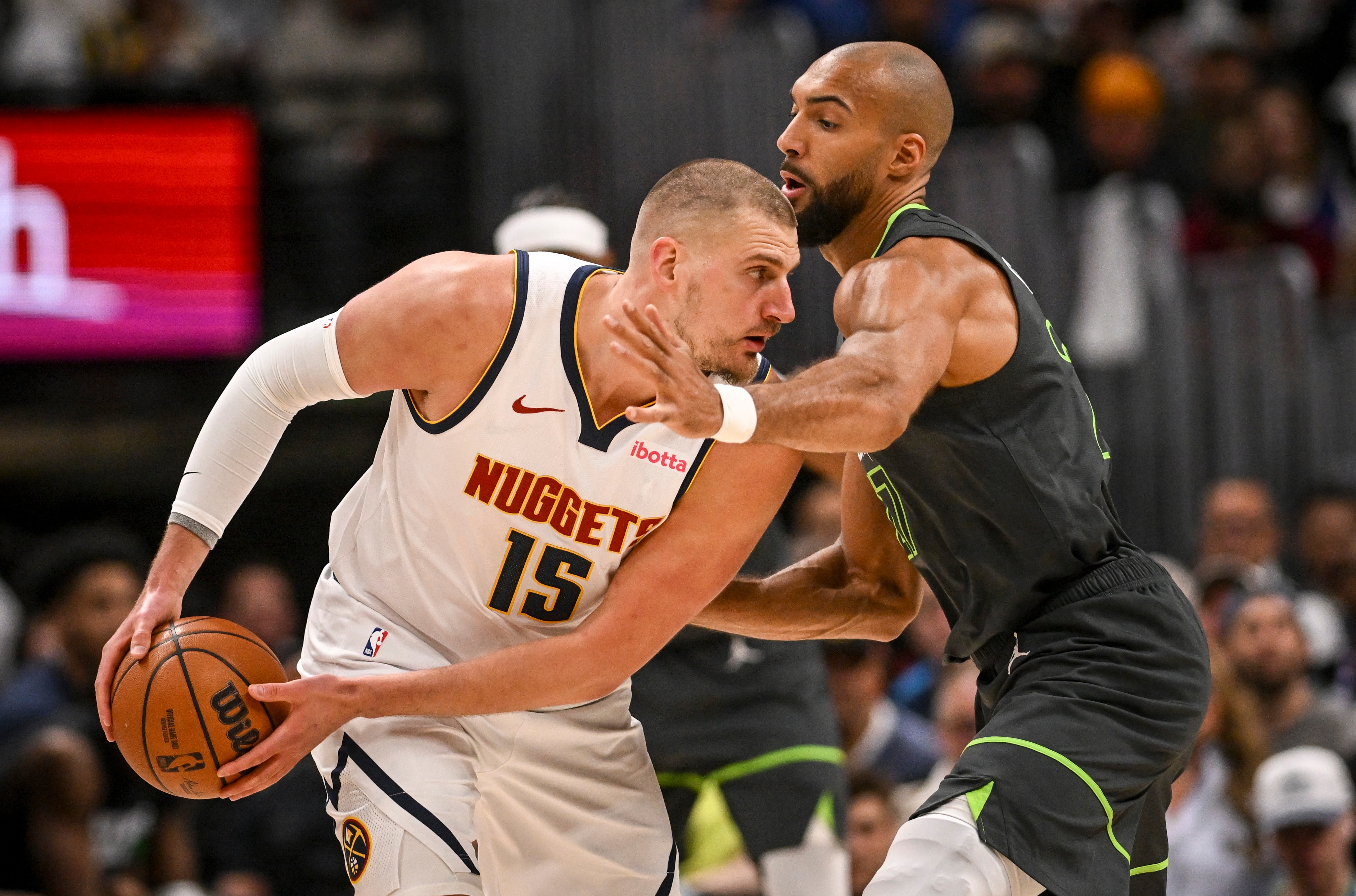 Nikola Jokic guarded by Rudy Gobert