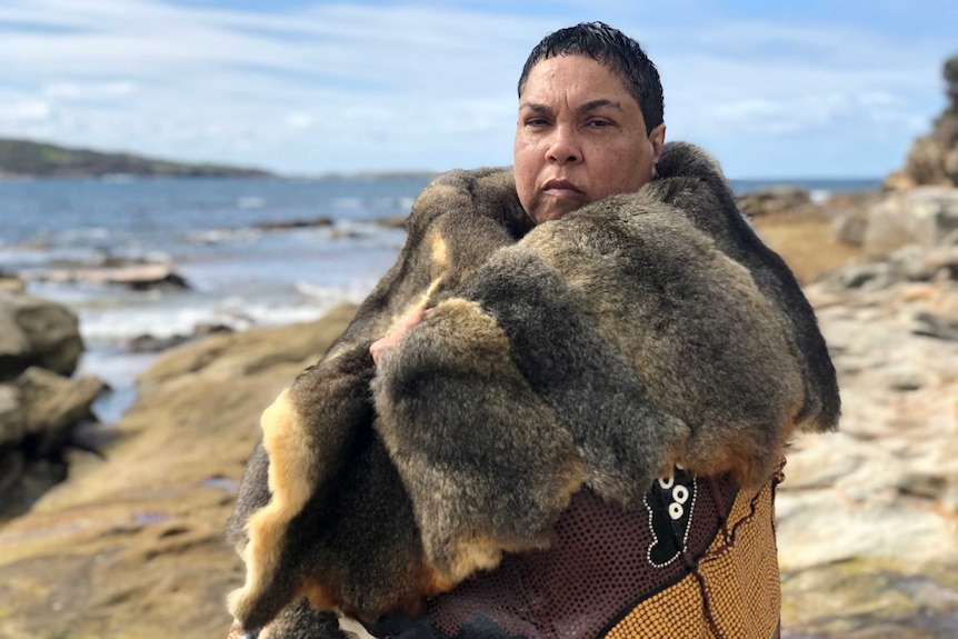 A woman in traditional attire looking into the distance