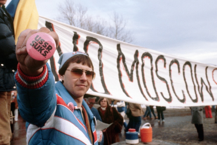 Protesters hold up anti-USSR signs calling for a boycott of the 1980 Moscow Olympic Games.