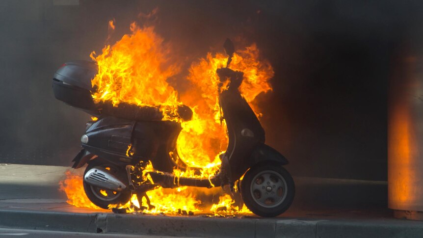 Flames engulf a motor scooter in Melbourne.