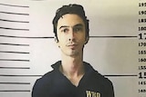 Mugshot of Christian Beasley, who escaped from Bali's Kerobokan prison. He is tall with dark hair and fair skin.