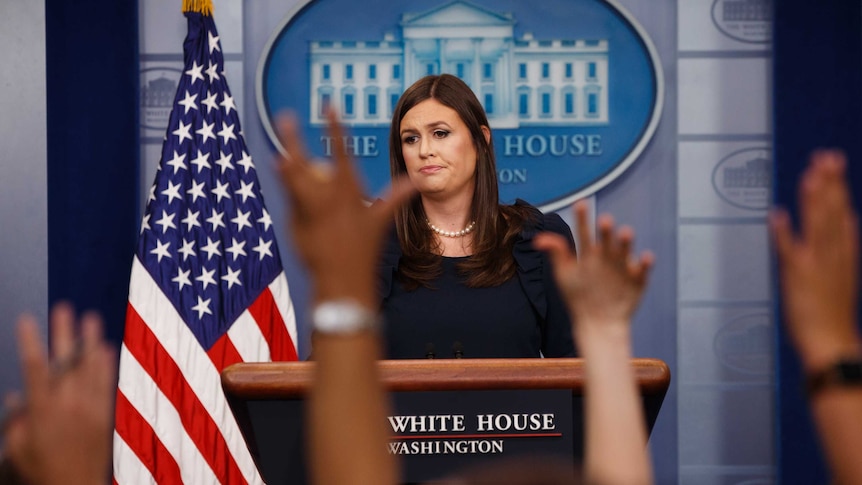 White House press secretary Sarah Huckabee Sanders listens to a question.