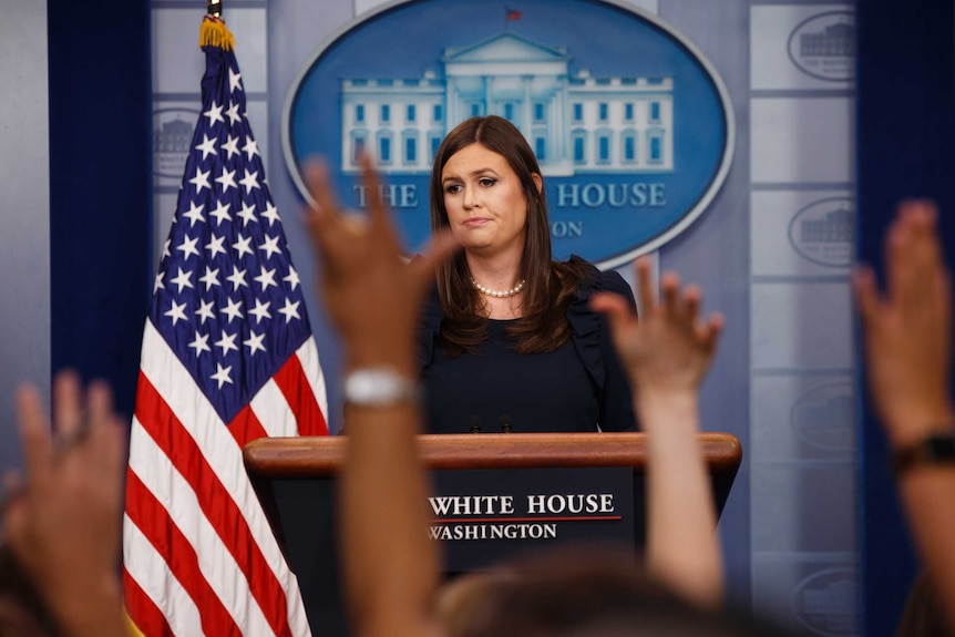 White House press secretary Sarah Huckabee Sanders listens to a question.