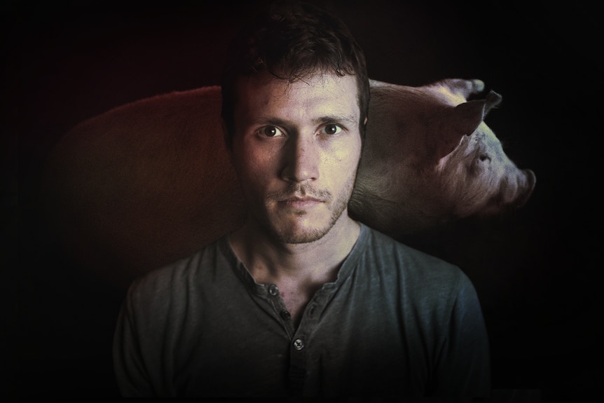 Composite image of a man with a pig behind him.