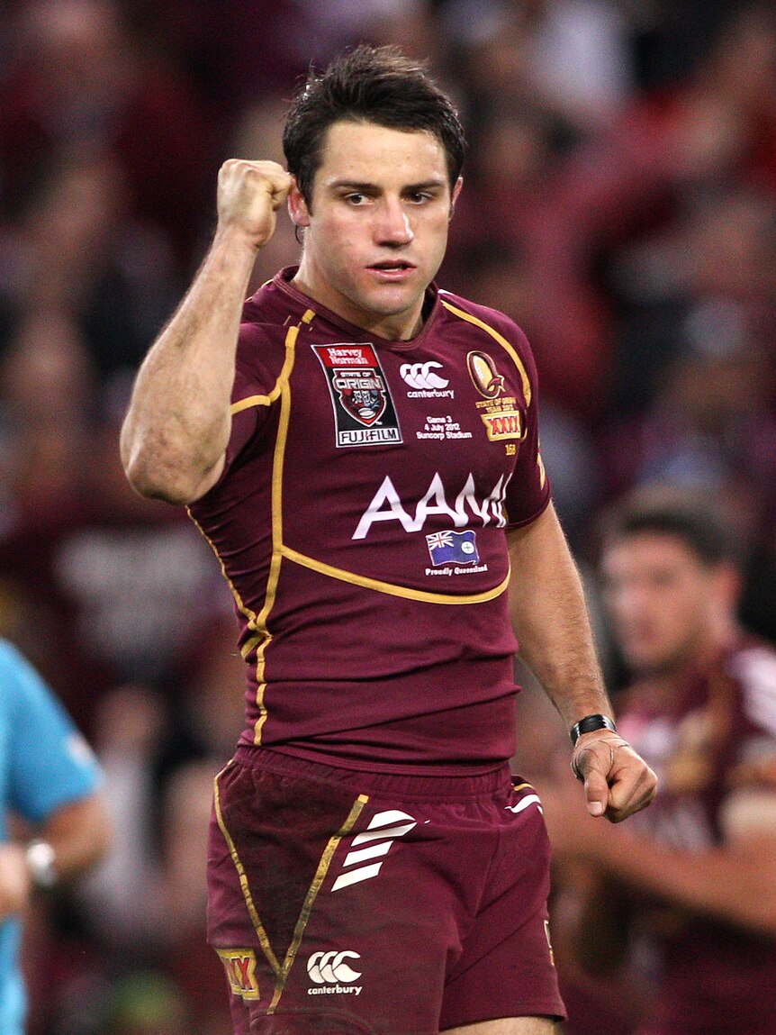 Man of the moment ... Cooper Cronk celebrates after kicking the winning field goal