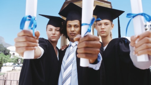 Creative: Three graduate students holding diplomas, outdoors (Stockbyte: Thinkstock)