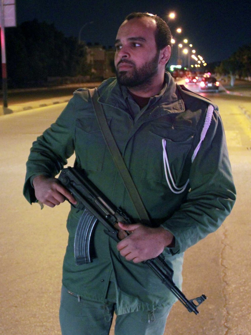 A Libyan policeman on patrol in Benghazi. Libya says it is surprised by the warnings.