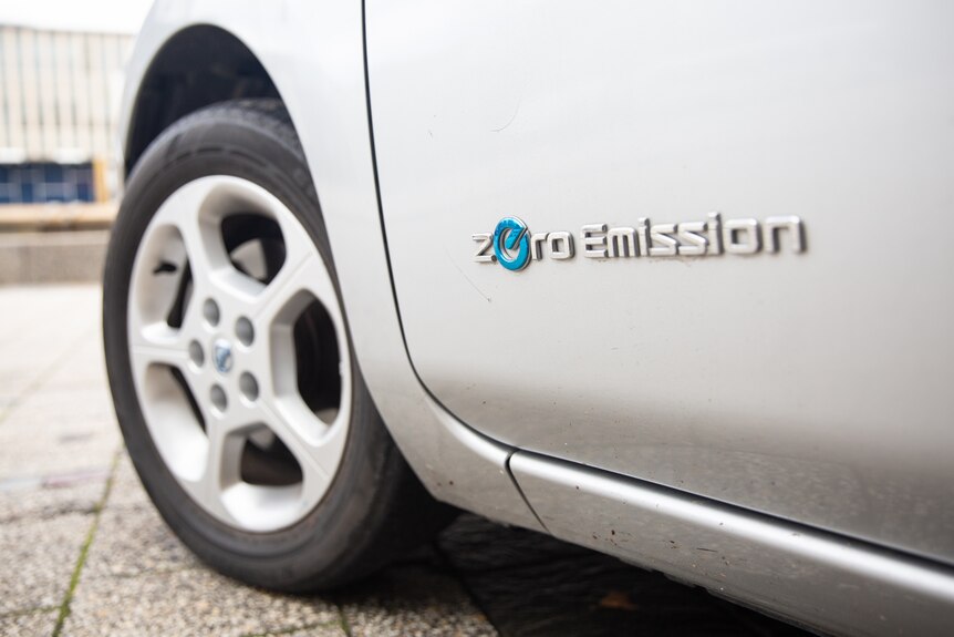 The side of an electric vehicle reads: 