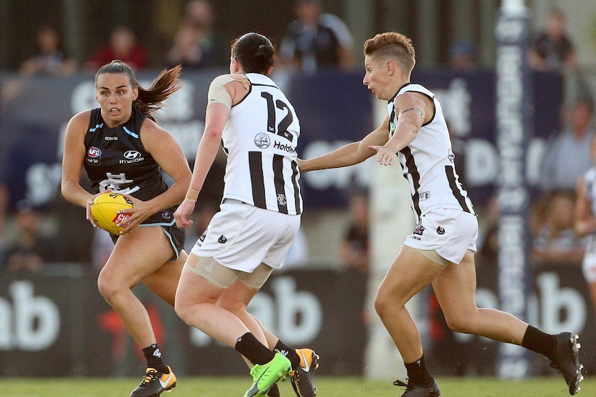 Lauren Brazzale of Carlton looks to beat the Collingwood defence in the AFWL opener at Princes Park.