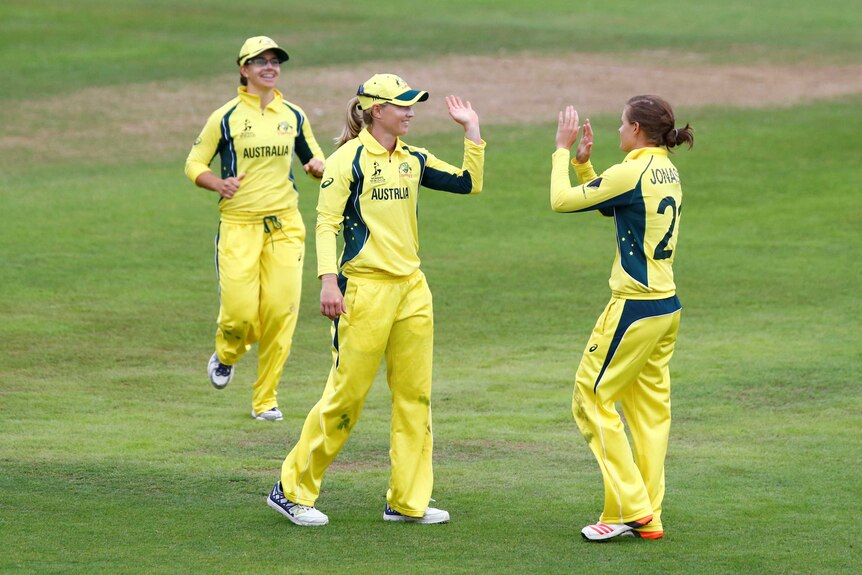 Meg Lanning celebrates the run out of West Indies' Anis Mohammed with Jess Jonassen (R).