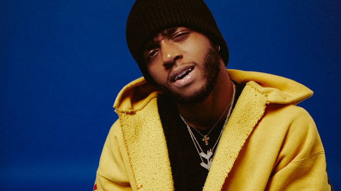 A 2017 press shot of 6LACK with his dreads shaved off