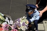 Melburnians lay flowers at a memorial in Bourke Street for victims of a car rampage.
