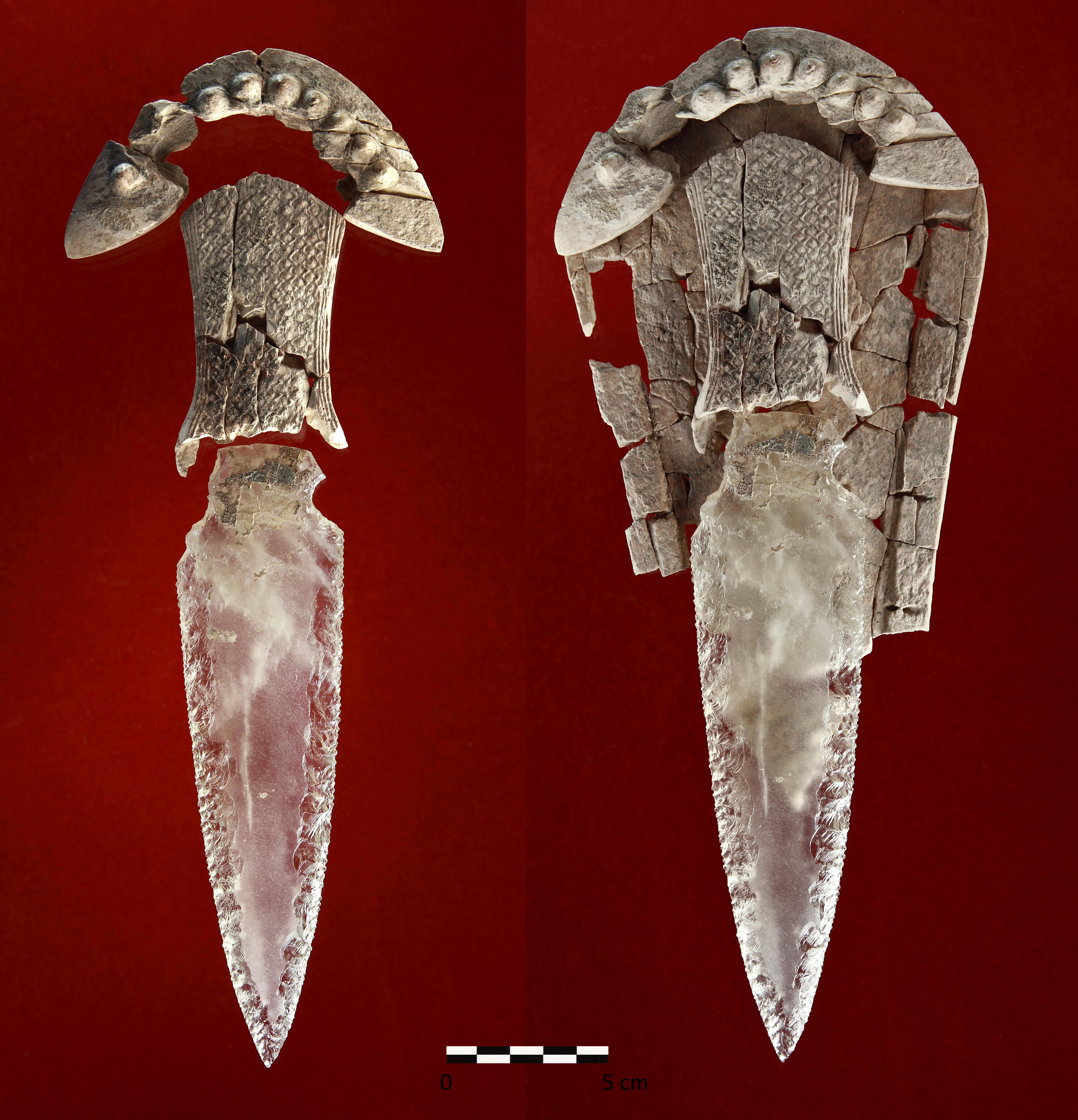 Two views of a dagger with a broken carved ivory hilt and a shaped, knapped rock crystal blade.