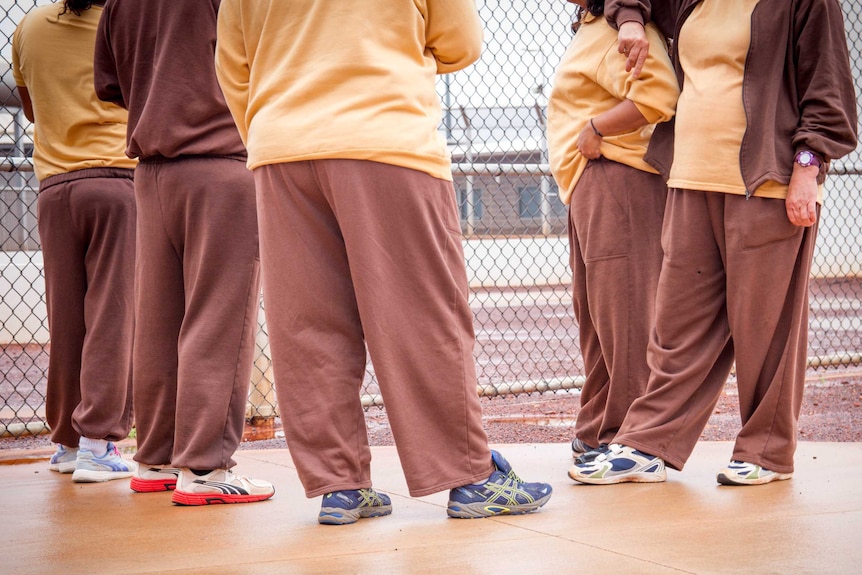 Five women standing together inside the Eastern Goldfields Regional prison in Kalgoorlie-Boulder