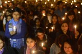 People hold candles at New Delhi vigil for gang-rape victim