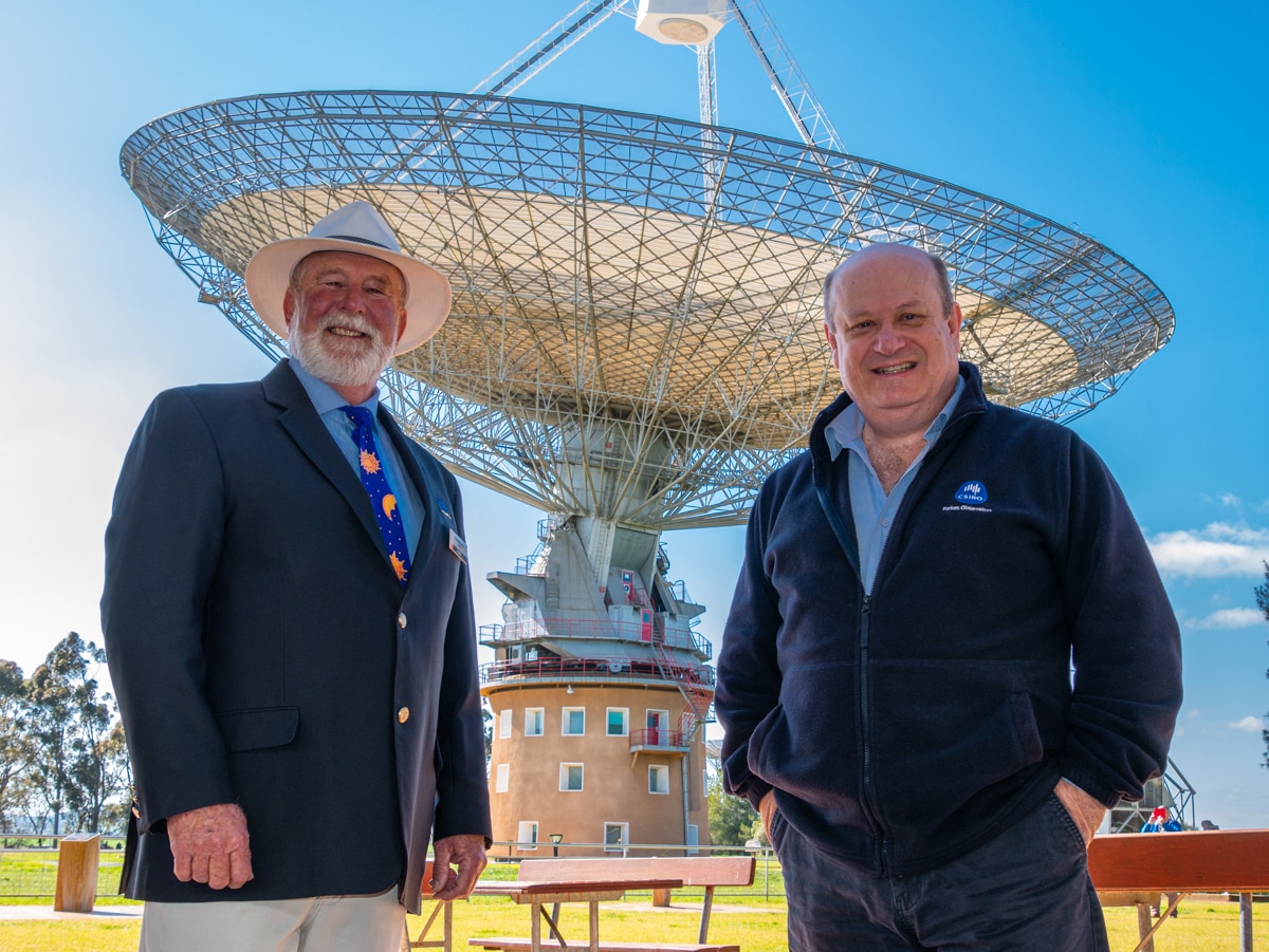 Ken Keith and John Sarkissian standing in front of the CSIRO Parkes Radio Telescope