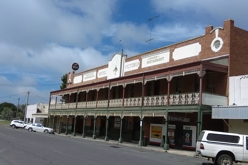 Old brick hotel with balcony and verandah