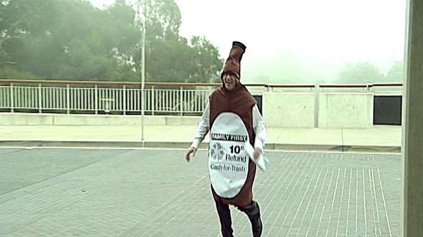 Family First Senator Steve Fielding arrives at Parliament House dressed in a beer bottle suit