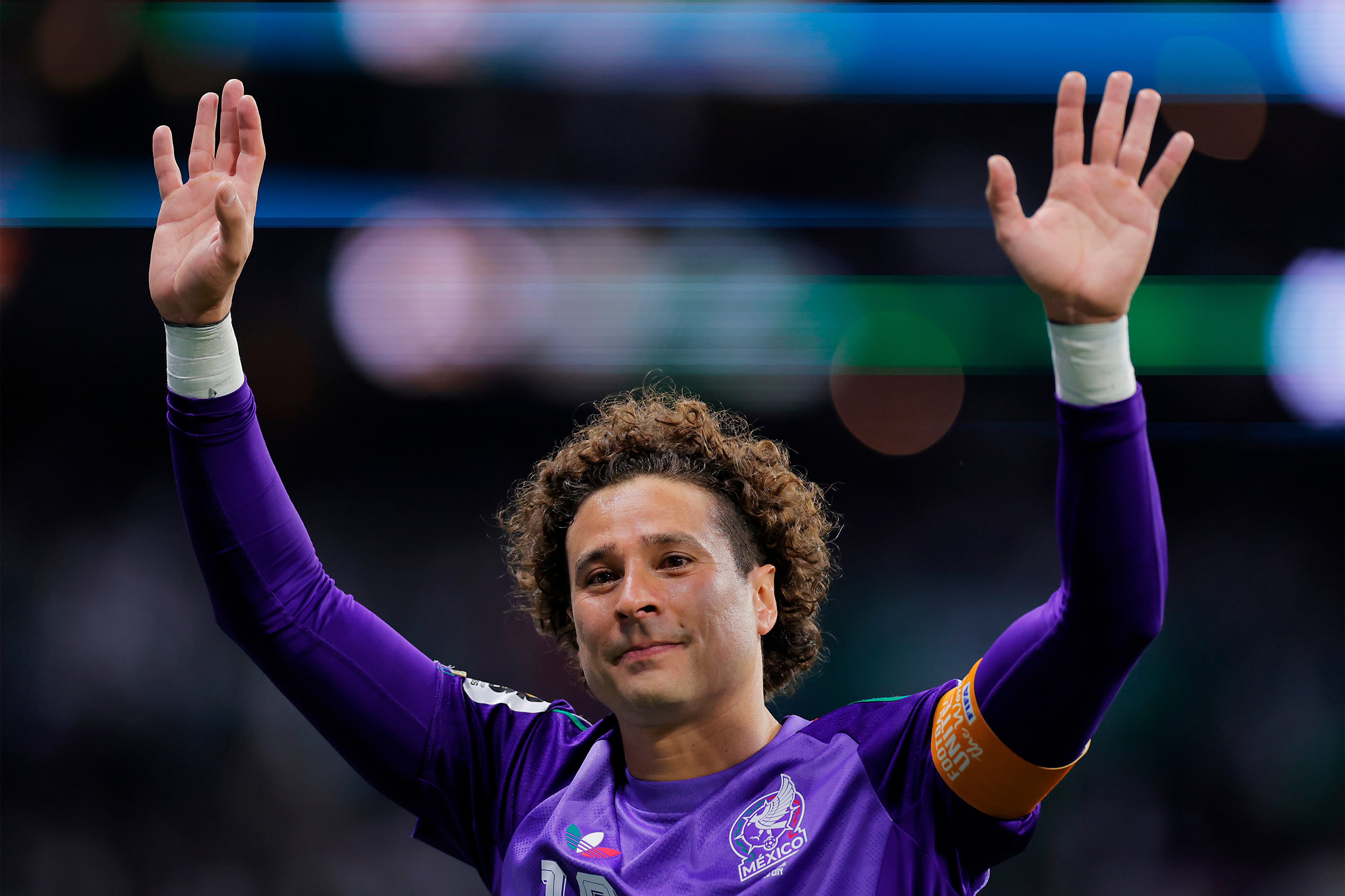 Guillermo Ochoa waves to the crowd.