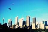 Remote-control helicopters fitted with cameras fly above Sydney