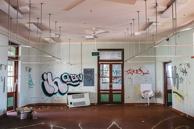 A ward of an old nursing home, graffiti on the walls