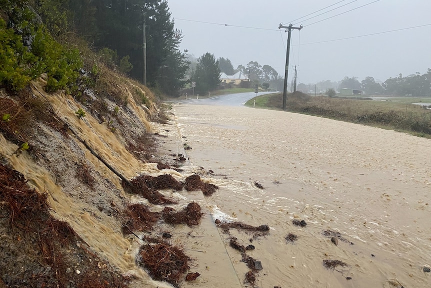 Floodwater across a rural road.